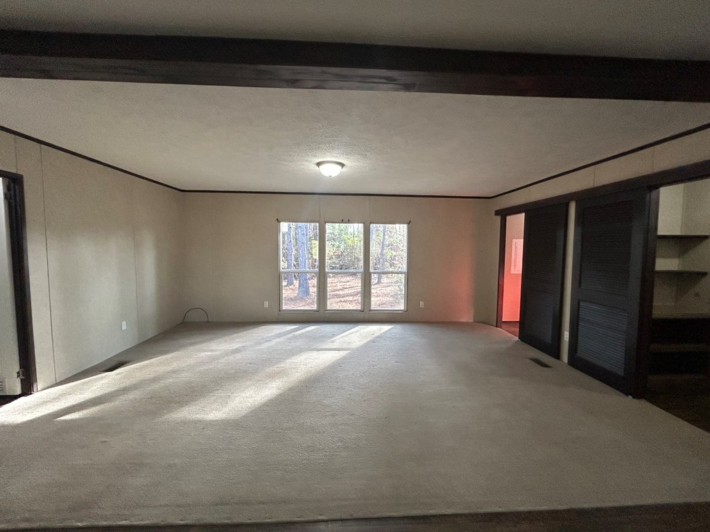 107 Oswichee Road Fort Mitchell, AL 36856 - Photo 35 of 56 a view of an empty room with a window