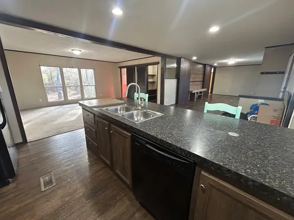 a kitchen with a table and chairs in it