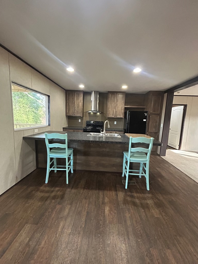 107 Oswichee Road Fort Mitchell, AL 36856 - Photo 40 of 56 a kitchen with a table and chairs in it