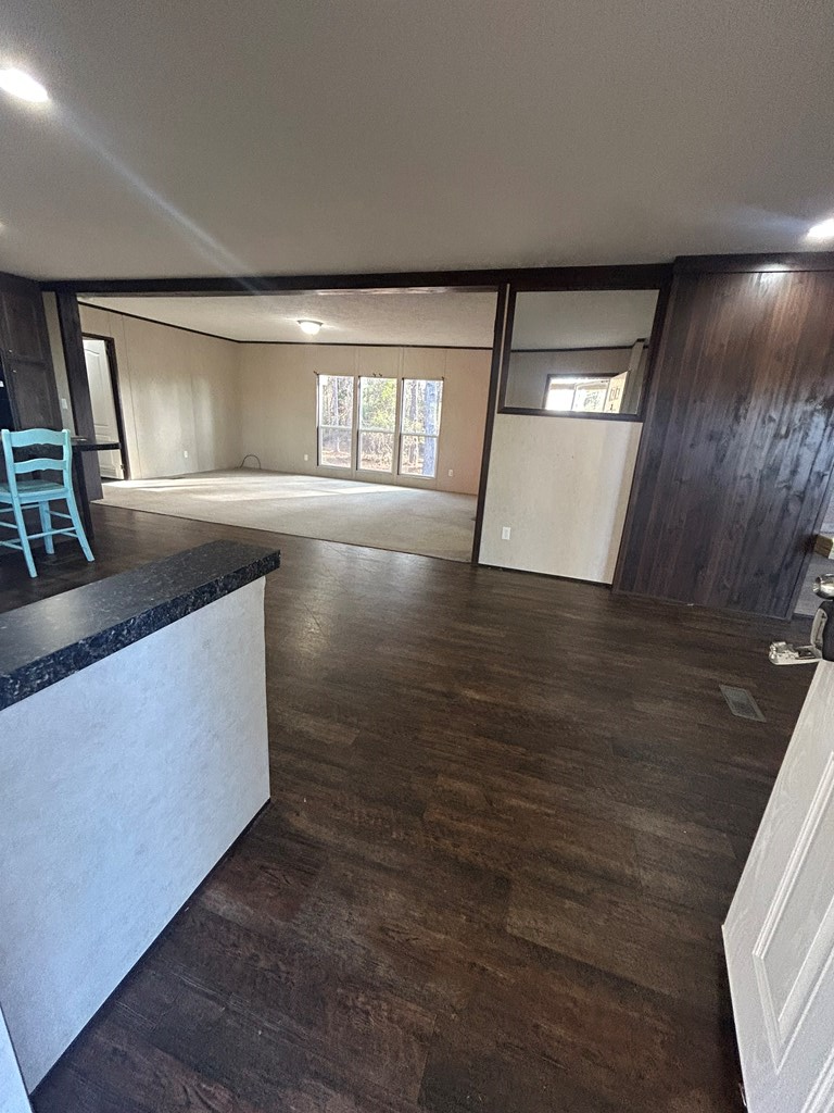 107 Oswichee Road Fort Mitchell, AL 36856 - Photo 41 of 56 wooden floor in an empty room with a window