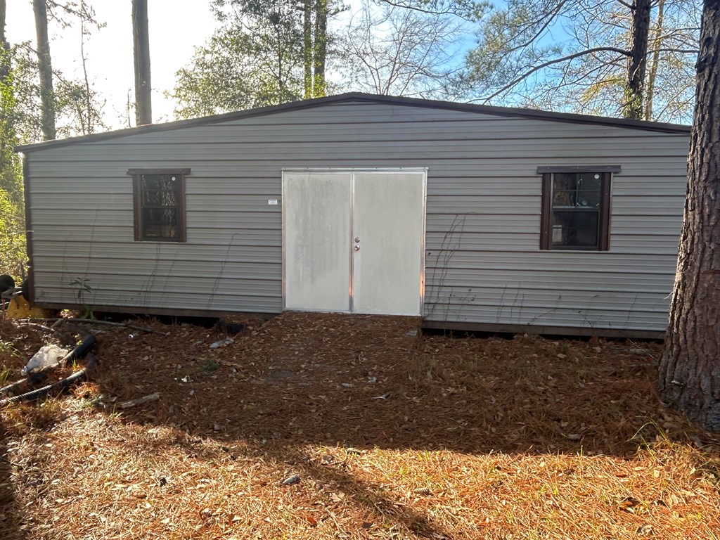 107 Oswichee Road Fort Mitchell, AL 36856 - Photo 49 of 56 a view of a house with a yard and garage