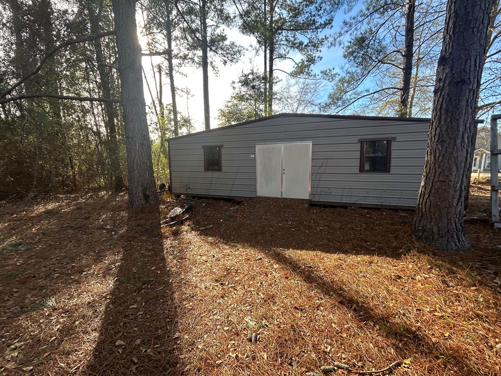 107 Oswichee Road Fort Mitchell, AL 36856 - Photo 50 of 56 a view of a house with a yard