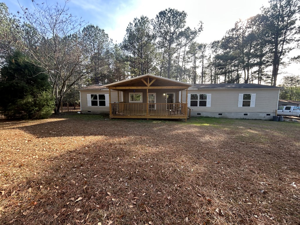 107 Oswichee Road Fort Mitchell, AL 36856 - Photo 53 of 56 a front view of a house with a garden and trees