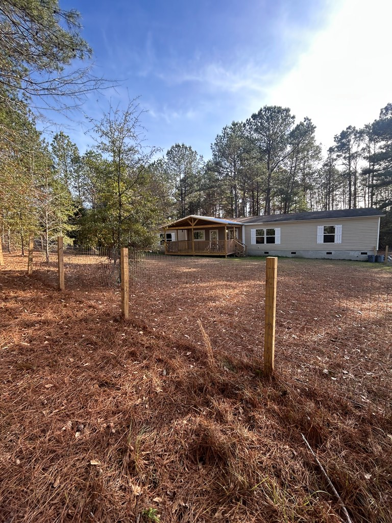 107 Oswichee Road Fort Mitchell, AL 36856 - Photo 55 of 56 a backyard of a house with lots of green space
