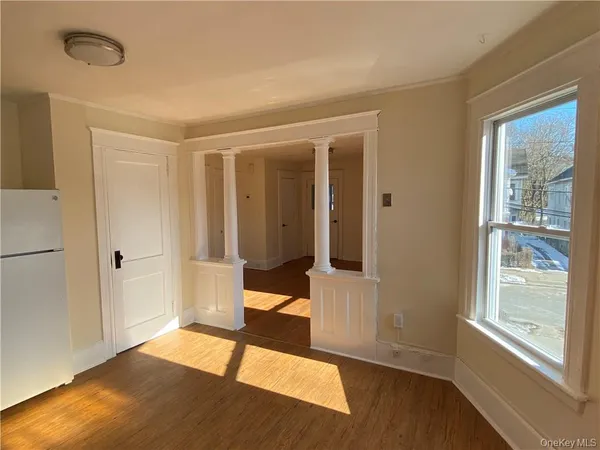a view of an empty room with glass door