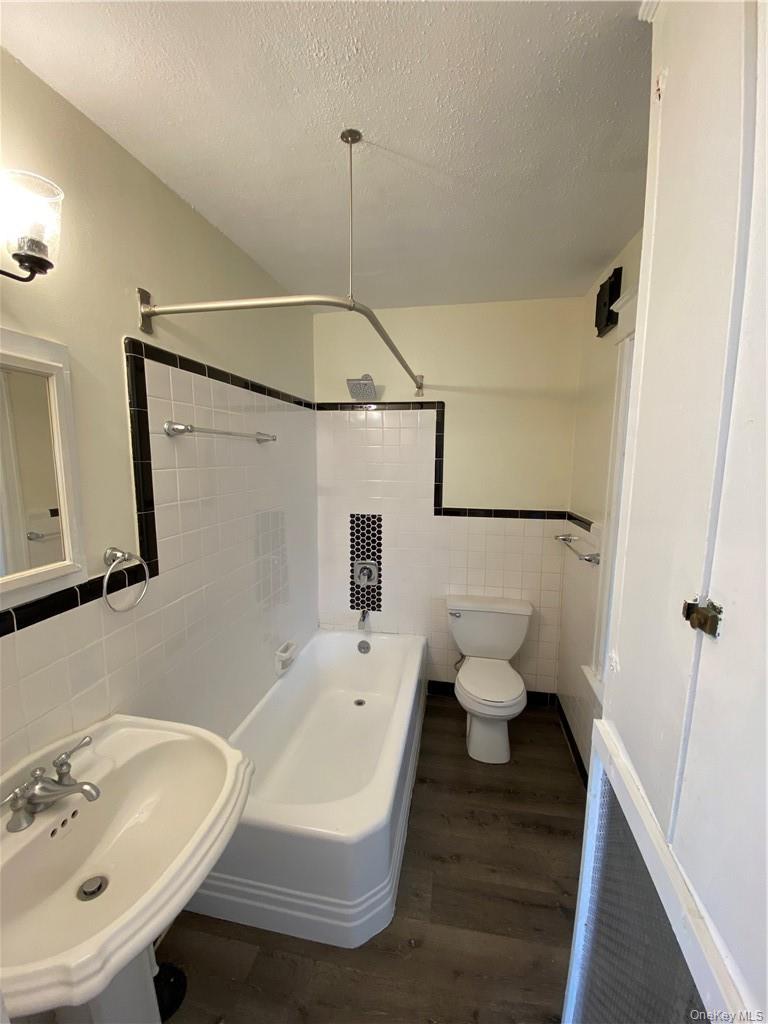20 South White Street, Unit 2 Poughkeepsie, NY 12601 - Photo 5 of 7 a bathroom with a sink toilet and shower