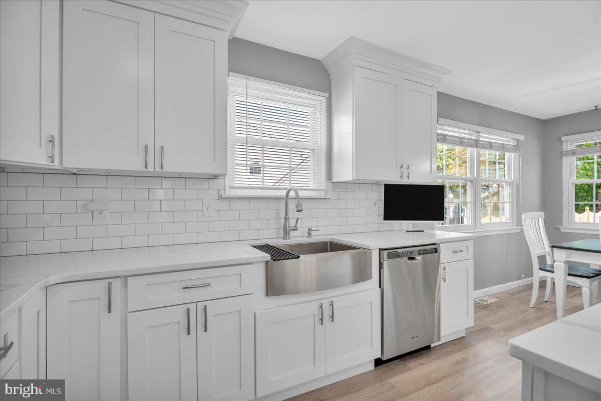 68 Sturbridge Drive Sicklerville, NJ 08081 - Photo 13 of 34 a kitchen with cabinets stainless steel appliances a sink and a window