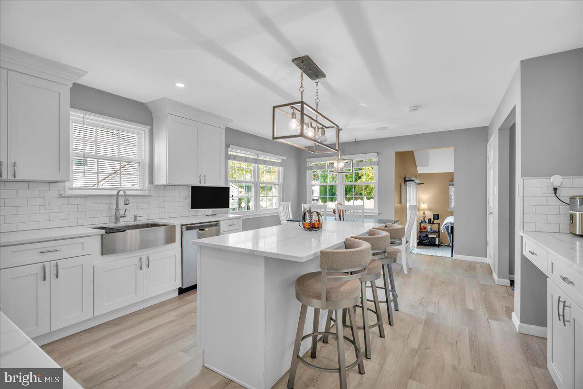 68 Sturbridge Drive Sicklerville, NJ 08081 - Photo 16 of 34 a kitchen with a sink cabinets and dining table chair