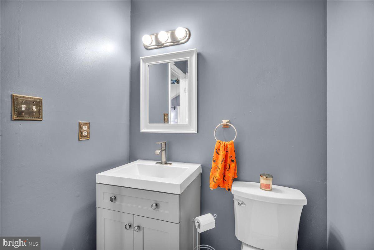 68 Sturbridge Drive Sicklerville, NJ 08081 - Photo 21 of 34 a bathroom with a toilet sink and mirror