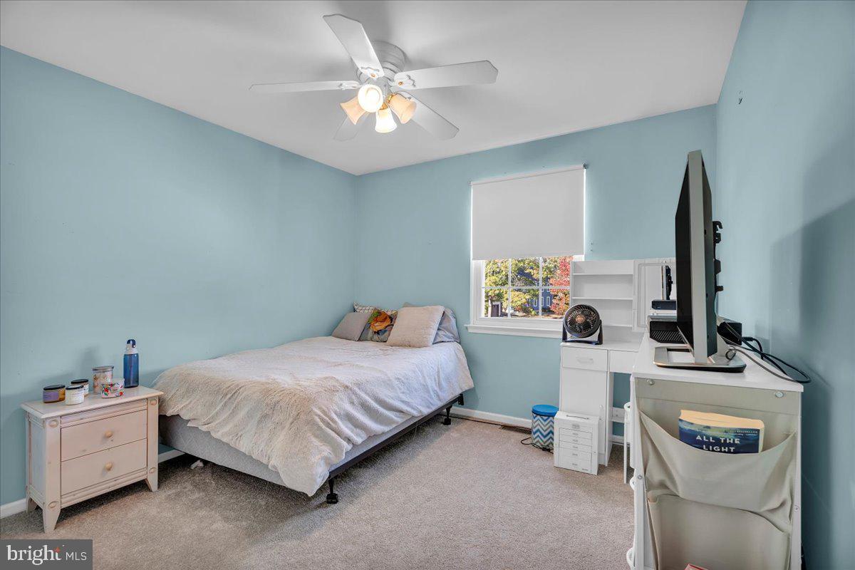 68 Sturbridge Drive Sicklerville, NJ 08081 - Photo 24 of 34 a bedroom with a bed and a chandelier
