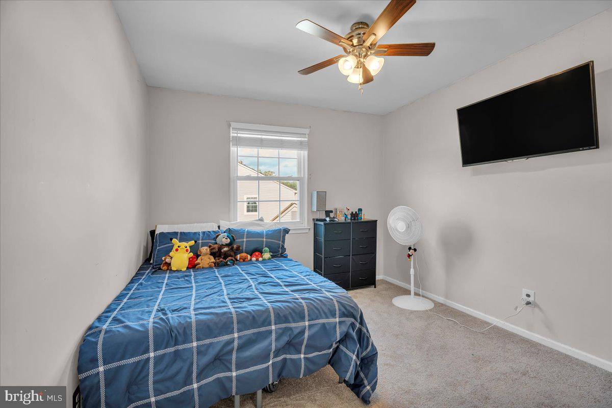 68 Sturbridge Drive Sicklerville, NJ 08081 - Photo 29 of 34 a bedroom with a bed and a flat screen tv