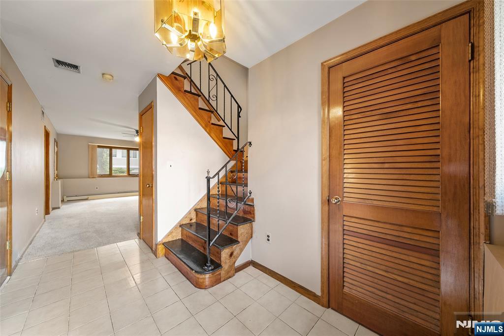 140 Allwood Road, Unit C Clifton, NJ 07012 - Photo 4 of 31 a view of entryway and hall with wooden floor