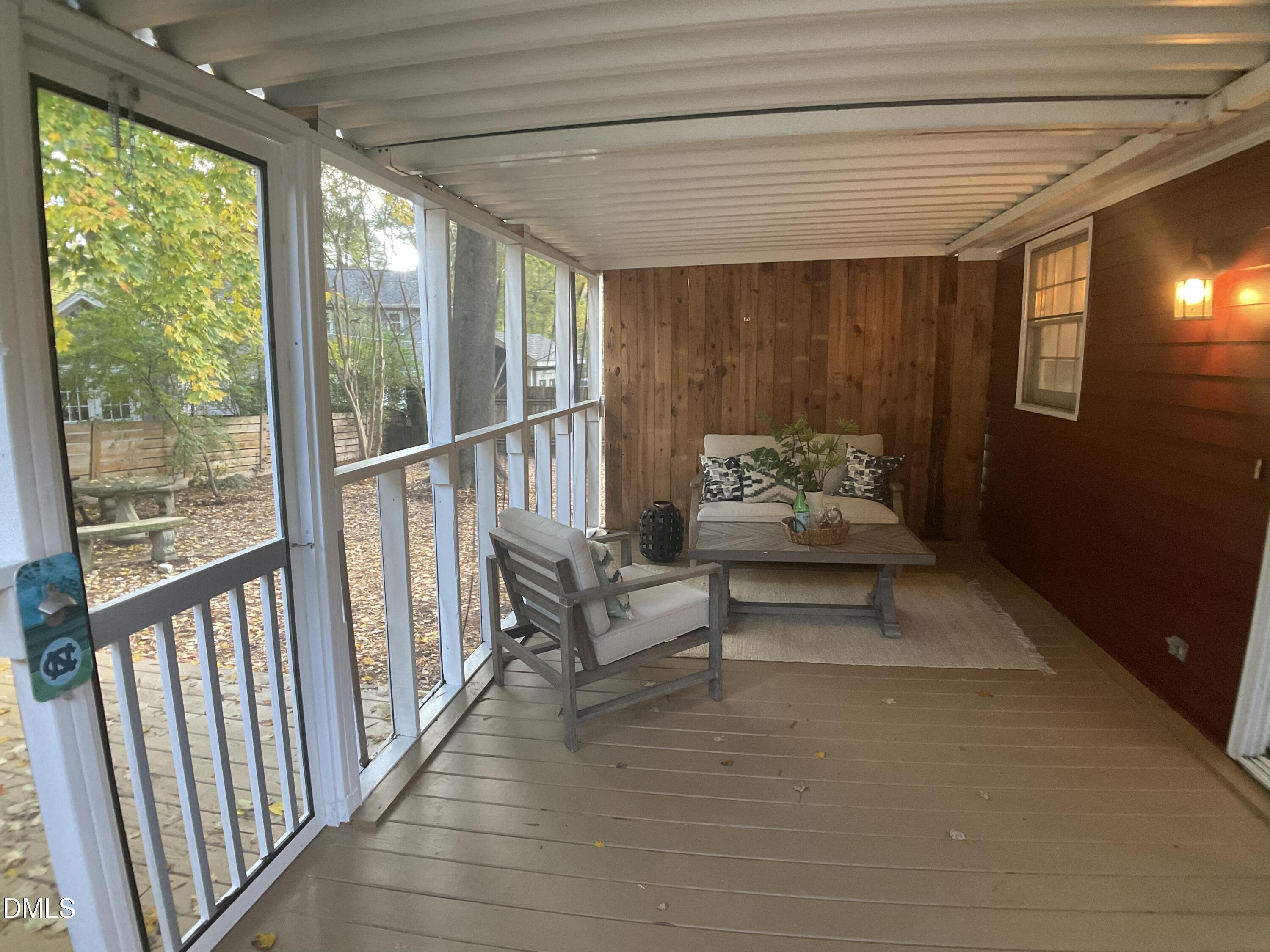 4219 Hope Valley Road Durham, NC 27707 - Photo 10 of 36 a living room with furniture and windows