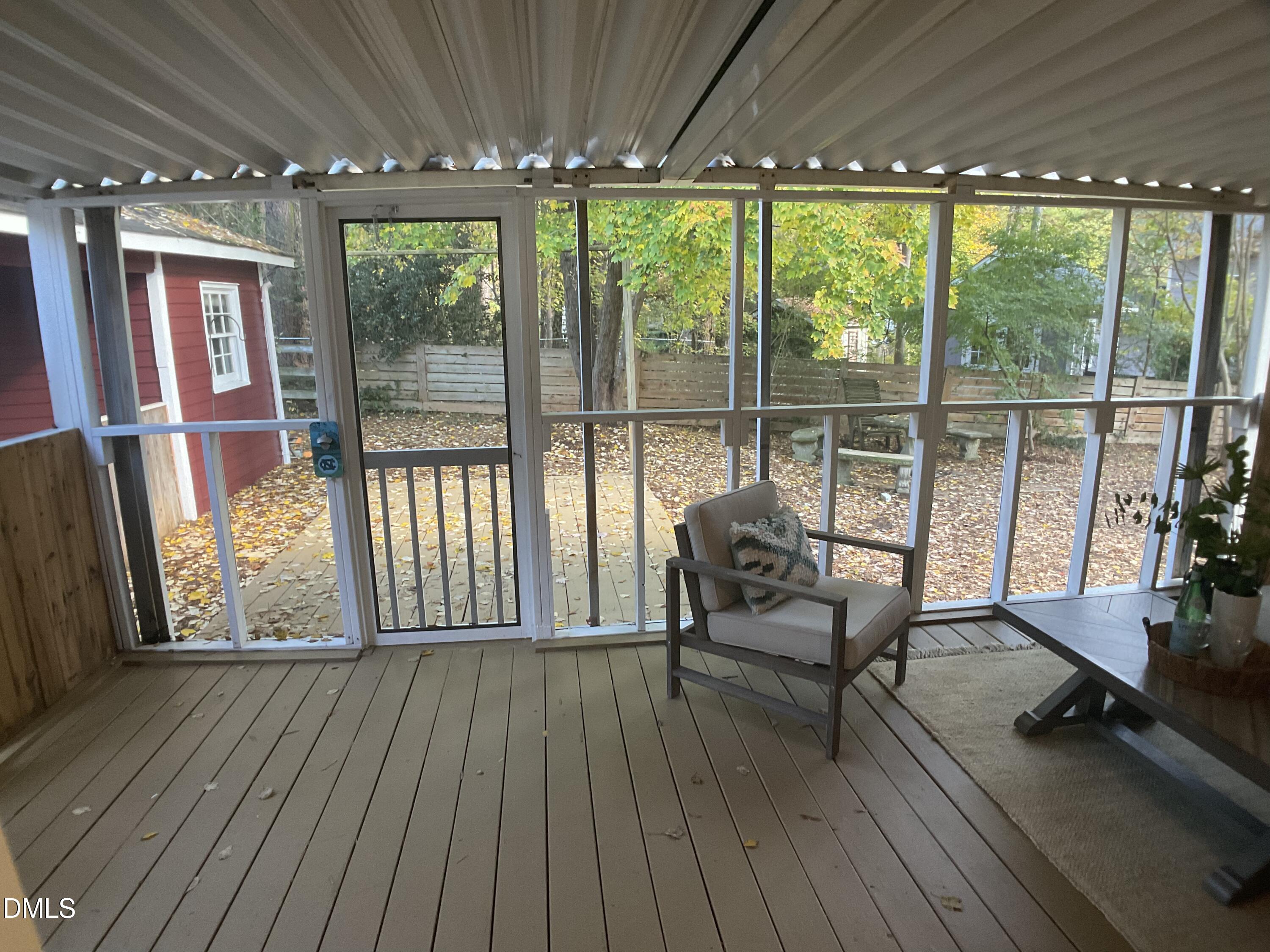 4219 Hope Valley Road Durham, NC 27707 - Photo 12 of 36 a living room with furniture and large windows