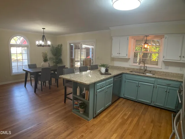 a kitchen with sink and cabinets