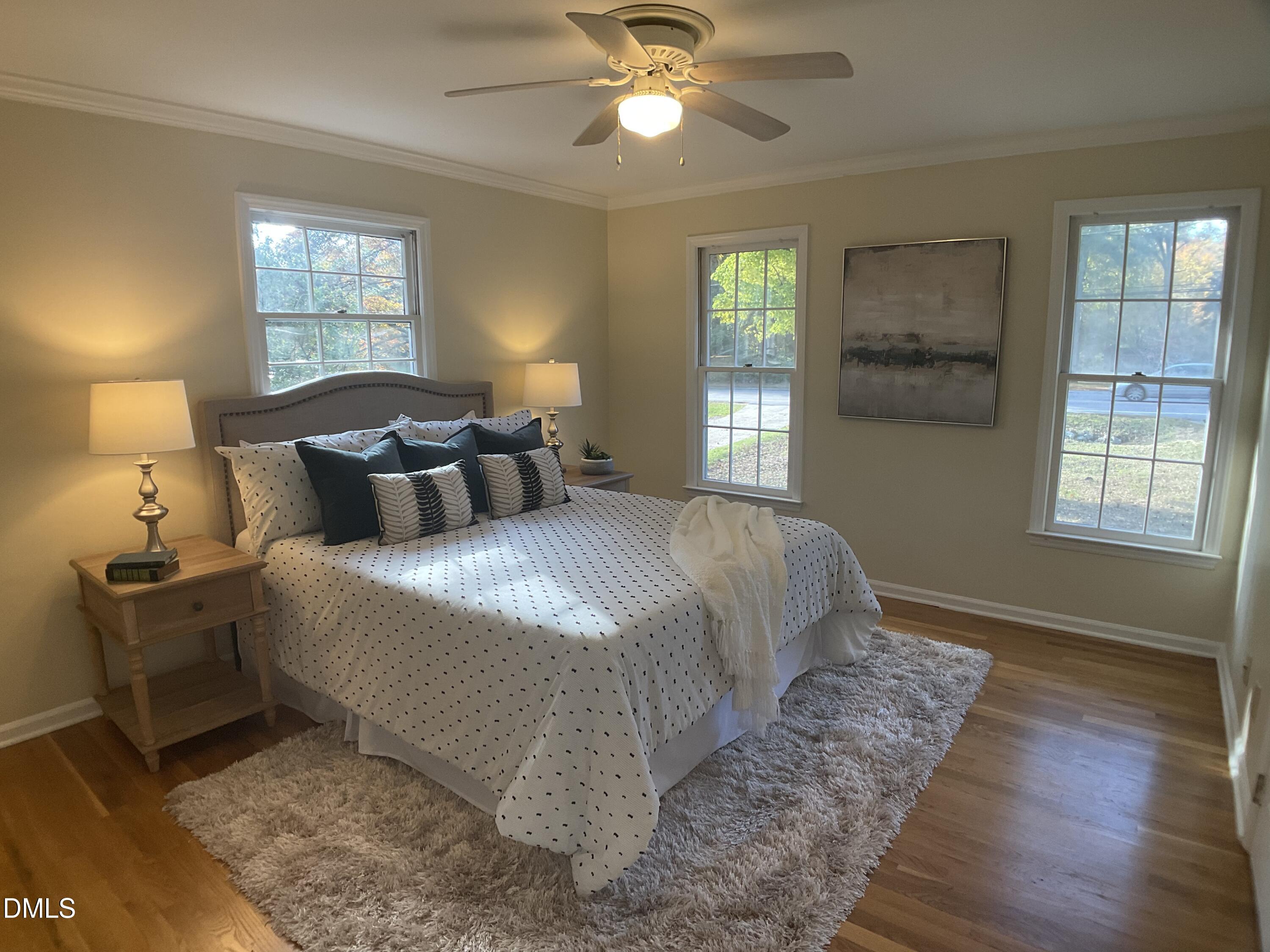 4219 Hope Valley Road Durham, NC 27707 - Photo 17 of 36 a bedroom with a bed and window