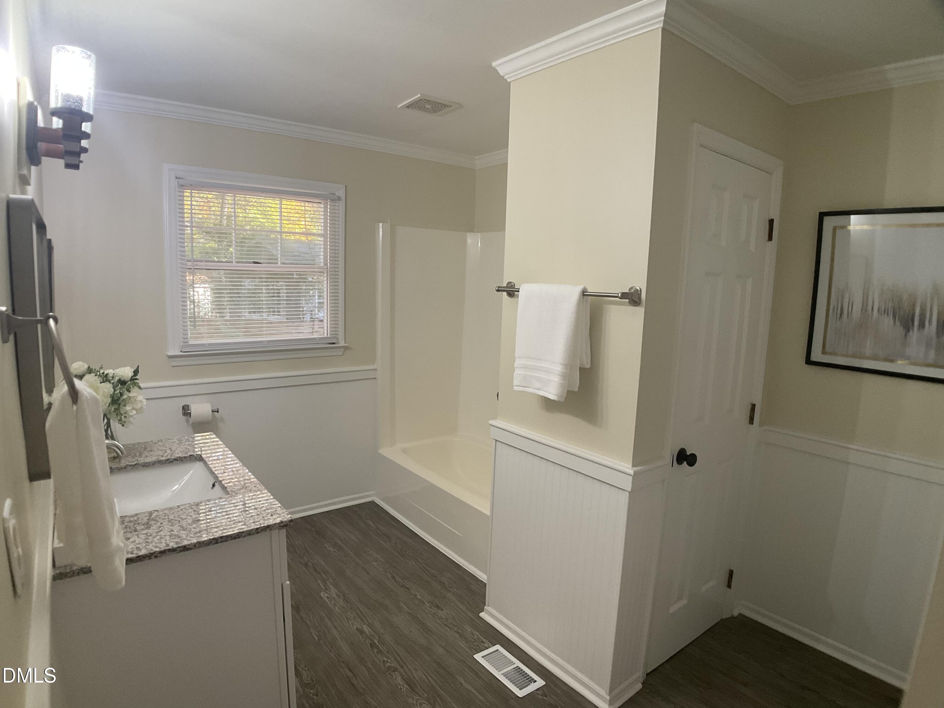 4219 Hope Valley Road Durham, NC 27707 - Photo 20 of 36 a bathroom with a granite countertop sink