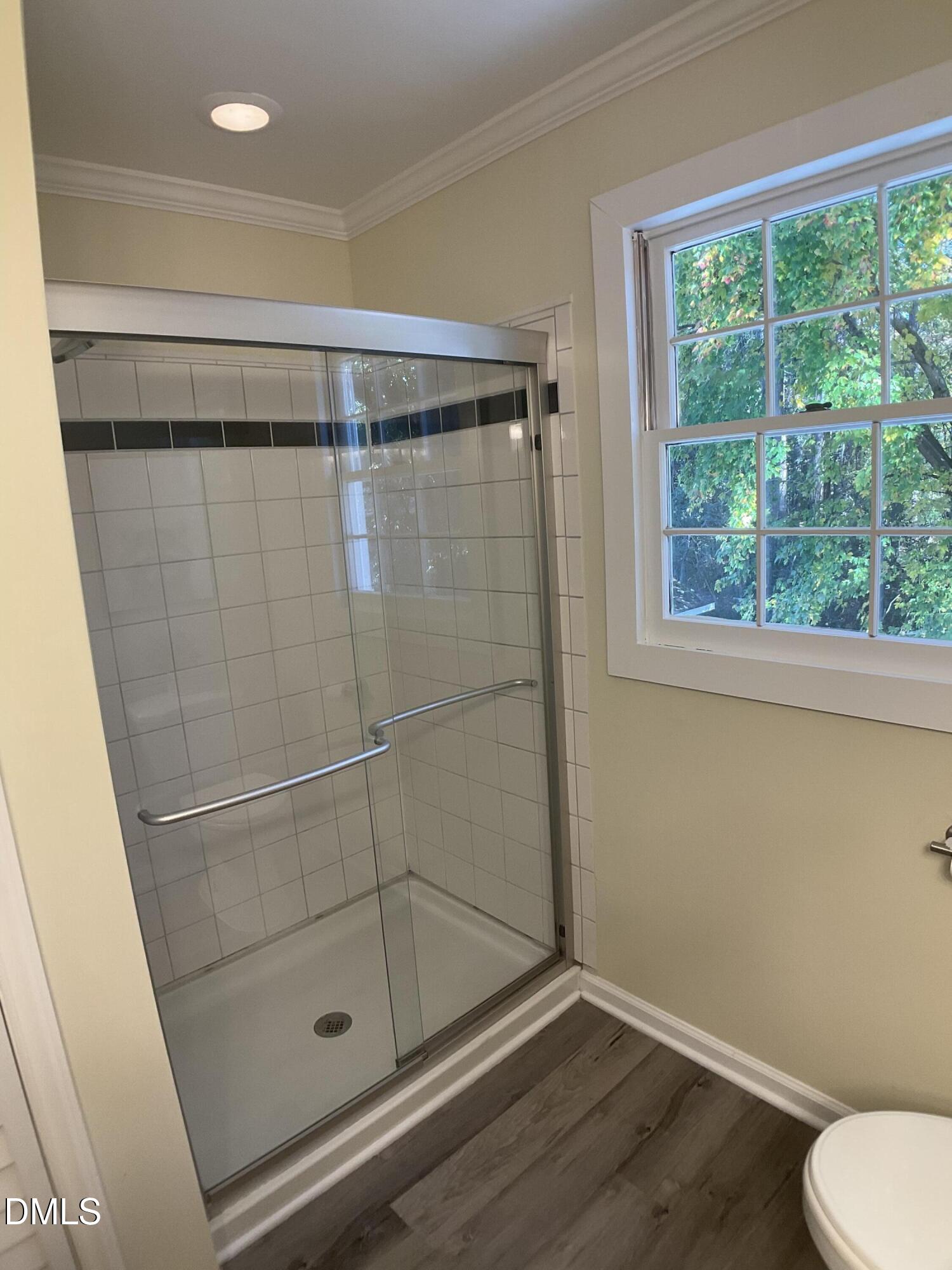 4219 Hope Valley Road Durham, NC 27707 - Photo 24 of 36 a bathroom with a shower and toilet