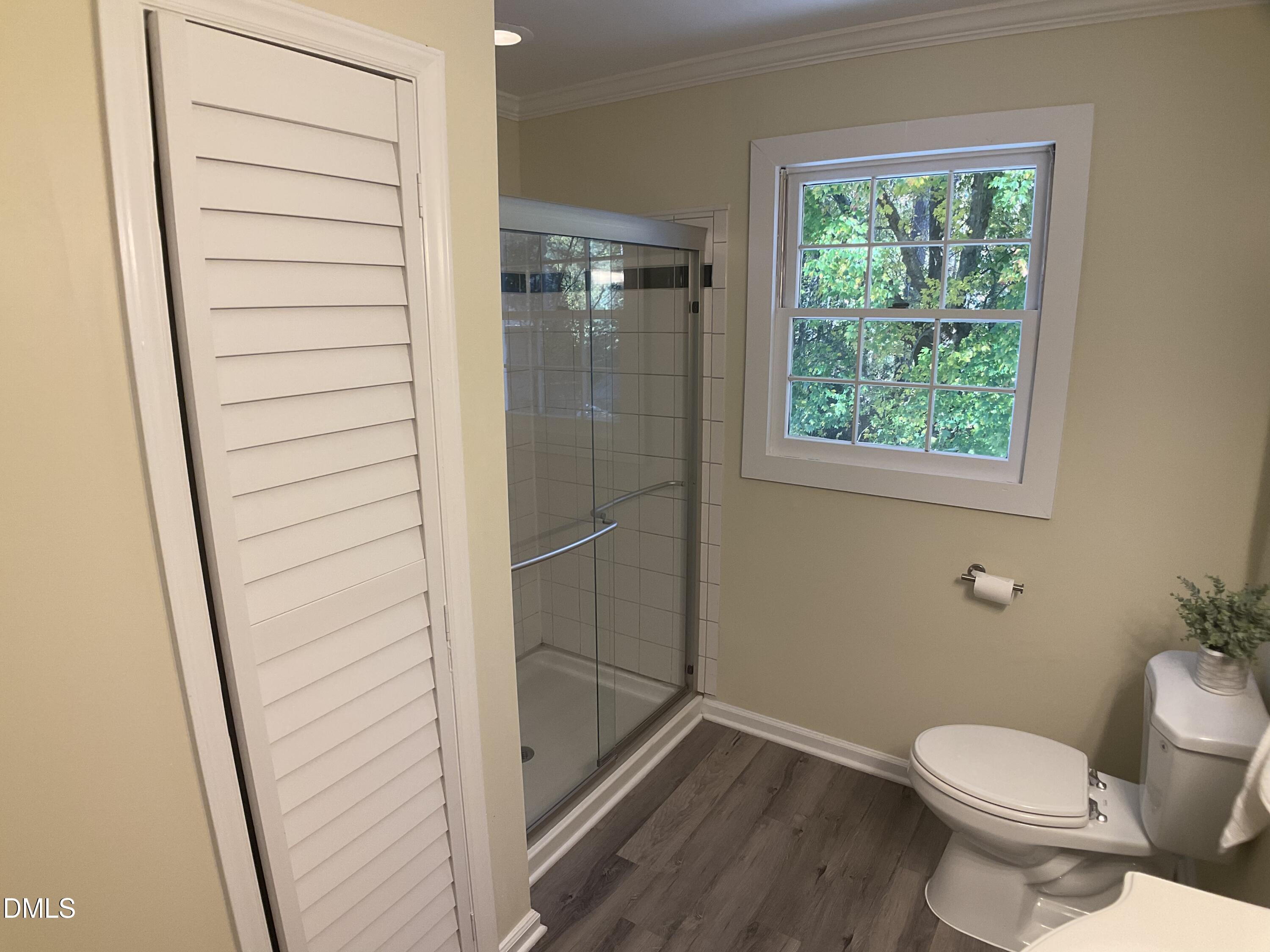 4219 Hope Valley Road Durham, NC 27707 - Photo 25 of 36 a bathroom with a toilet and a shower
