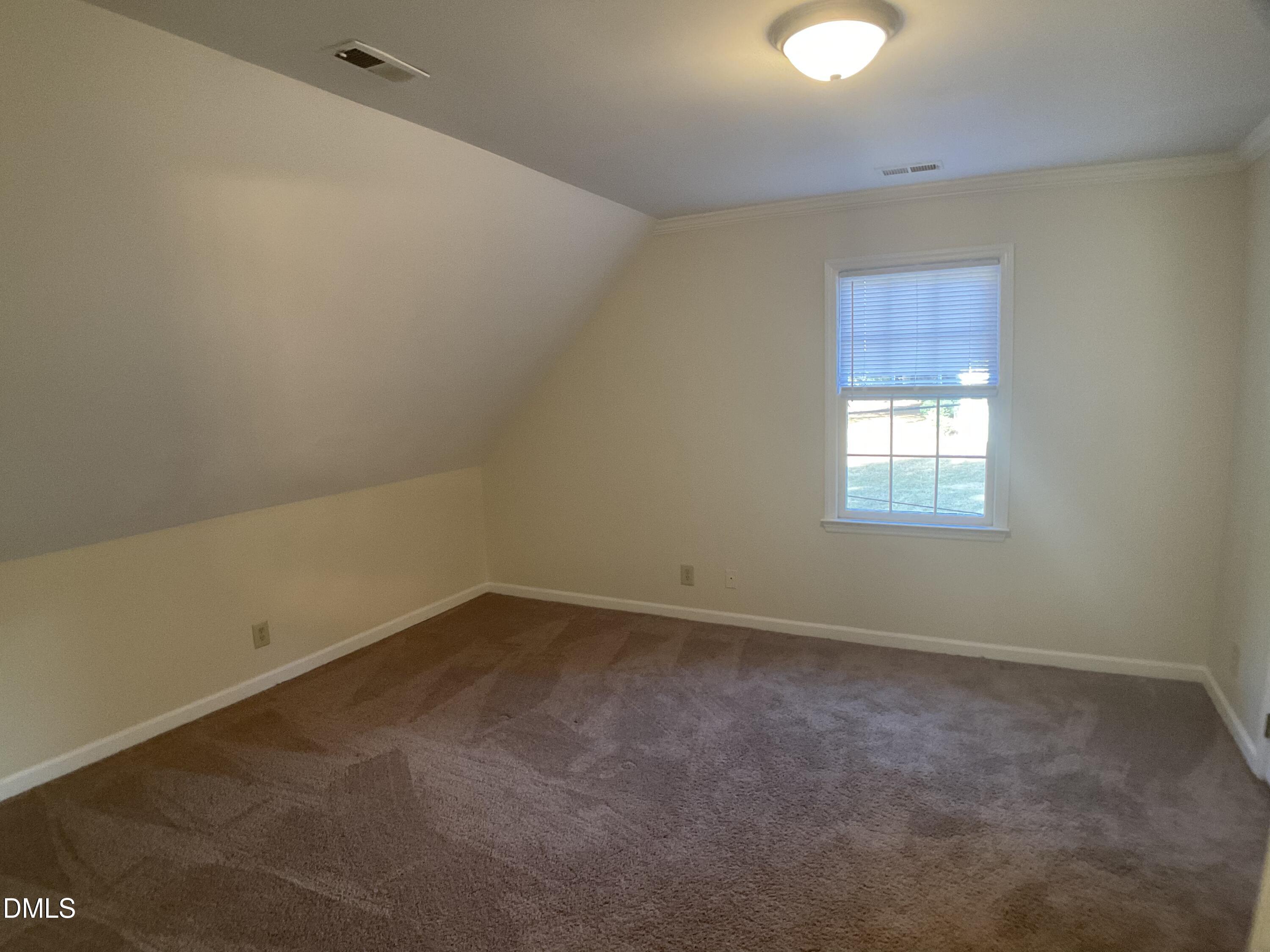 4219 Hope Valley Road Durham, NC 27707 - Photo 26 of 36 an empty room with a window