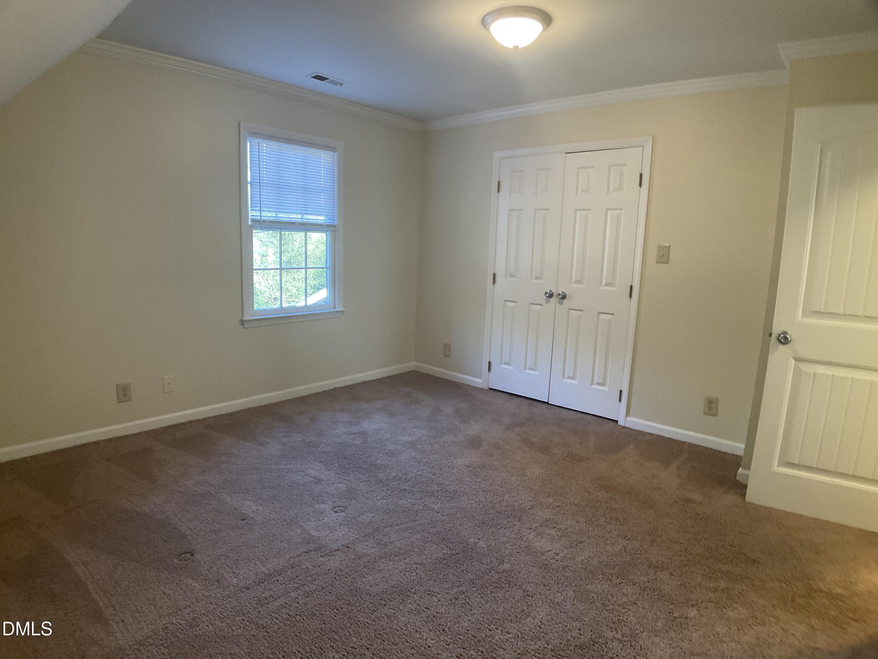 4219 Hope Valley Road Durham, NC 27707 - Photo 27 of 36 a view of an empty room and a window
