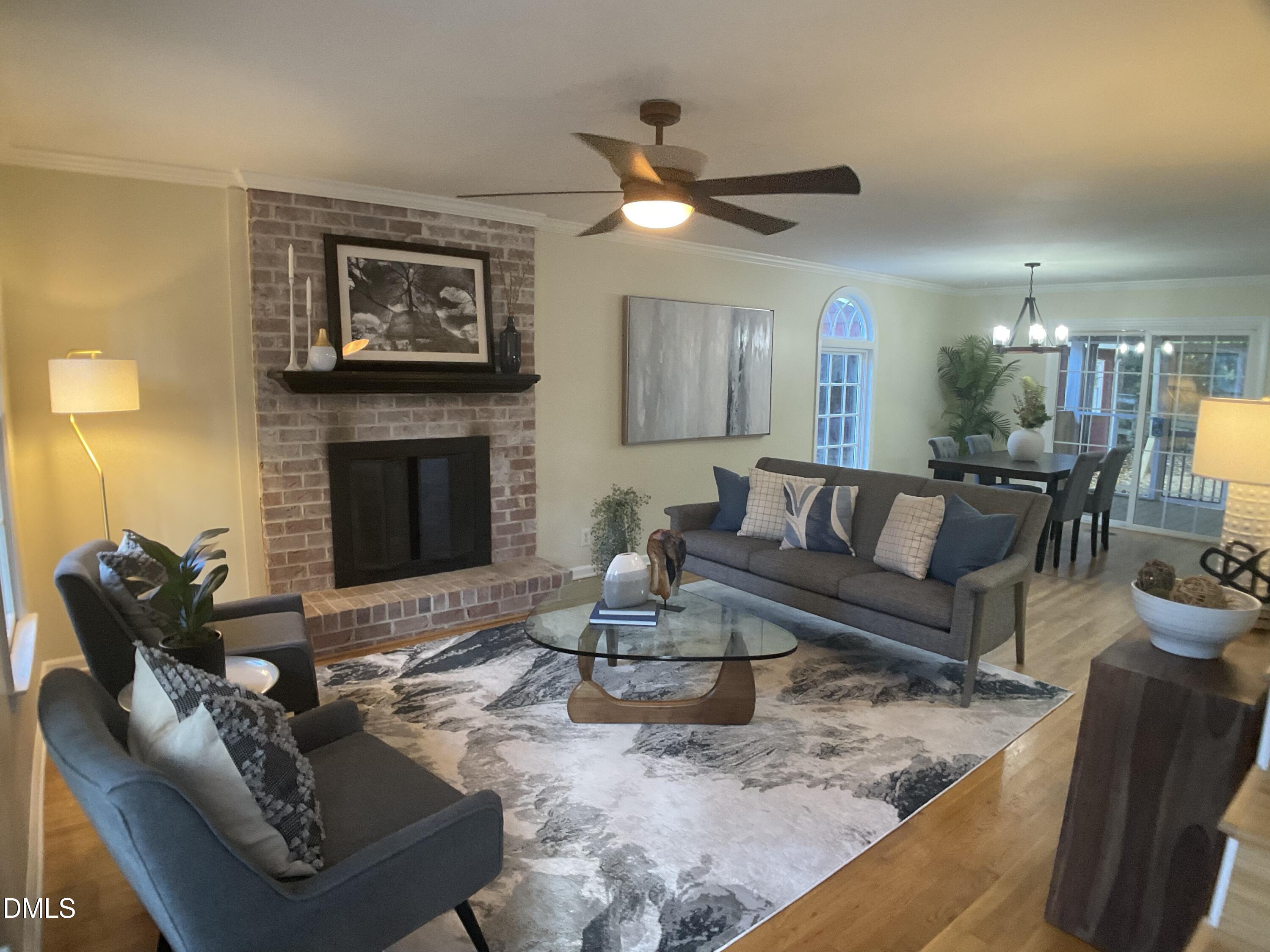 4219 Hope Valley Road Durham, NC 27707 - Photo 4 of 36 a living room with furniture and a fireplace