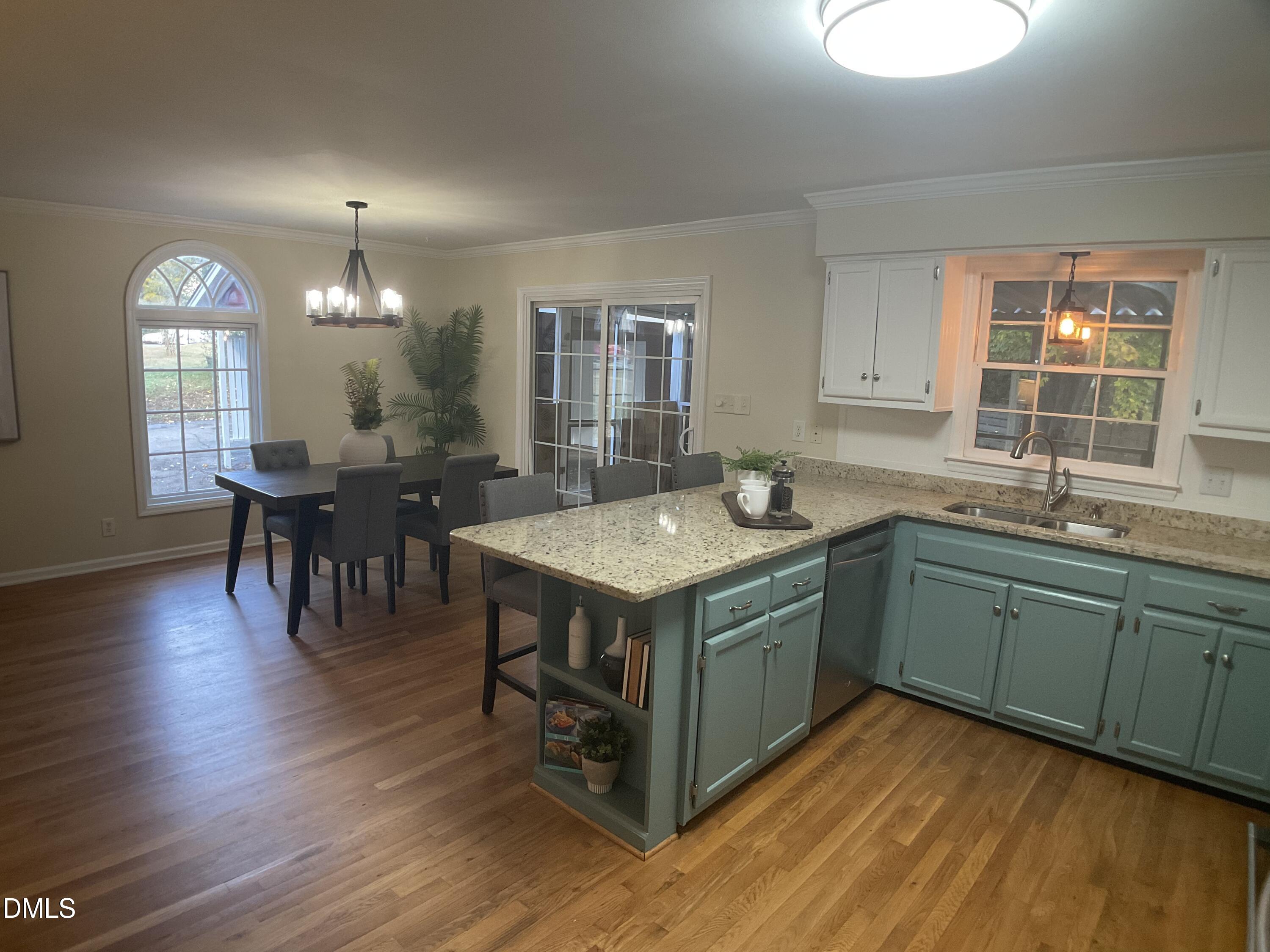 4219 Hope Valley Road Durham, NC 27707 - Photo 5 of 36 a kitchen with sink and wooden floor