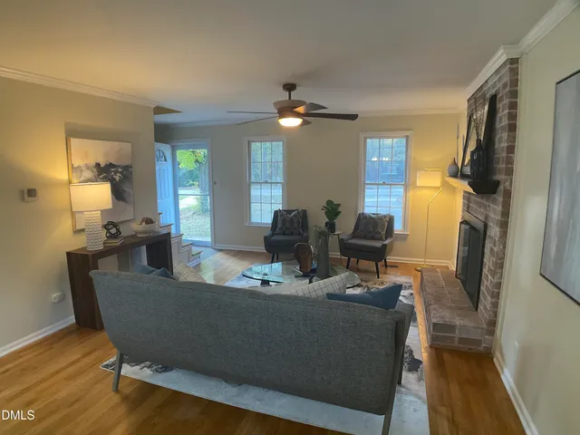 a dining room with furniture and wooden floor