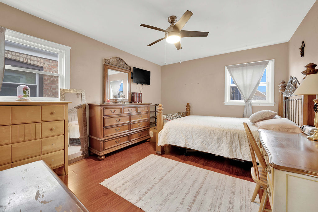 7234 South Ridgeway Avenue Chicago, IL 60629 - Photo 9 of 27 a bedroom with a bed and a dresser