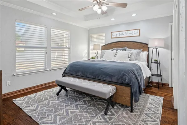 a bedroom with a bed and a table in it