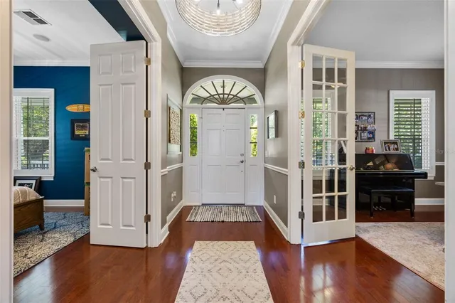 a living room with a fireplace and a flat screen tv