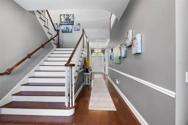 a kitchen with stainless steel appliances granite countertop a refrigerator and a stove