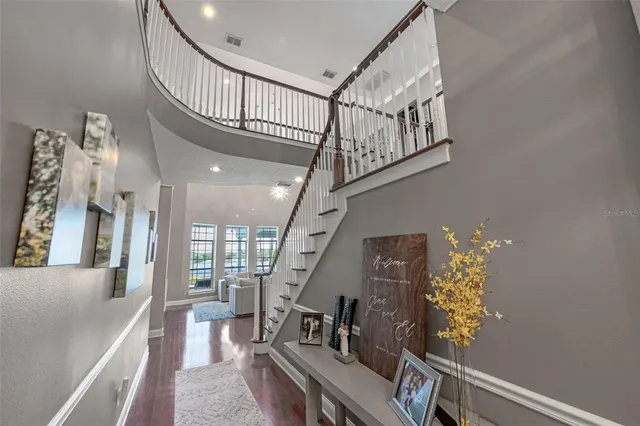 a kitchen with stainless steel appliances kitchen island granite countertop a refrigerator and a stove