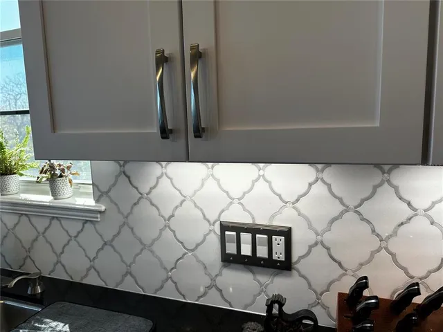 a view of a patio with swimming pool table and chairs