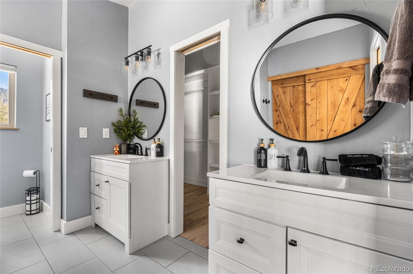 79 Beaver Road Idaho Springs, CO 80452 - Photo 28 of 50 a bathroom with a sink and a mirror