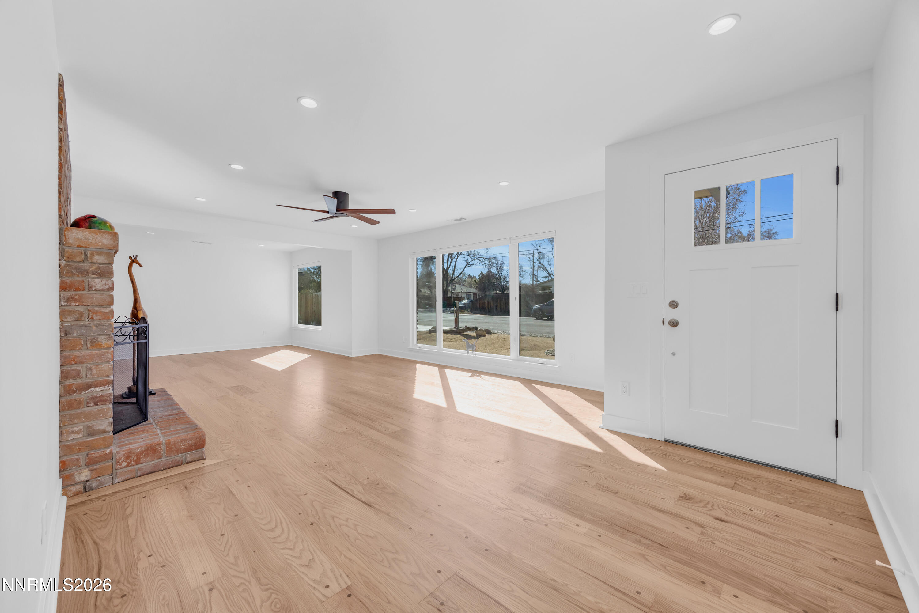 1355 Charles Drive Reno, NV 89509 - Photo 3 of 26 a view of empty room with wooden floor and fan