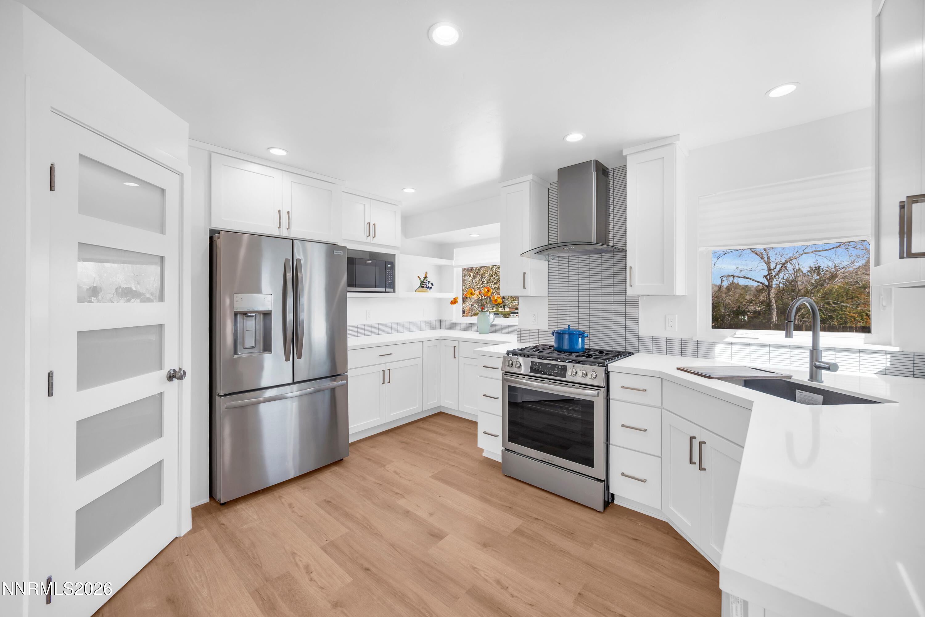 1355 Charles Drive Reno, NV 89509 - Photo 9 of 26 a kitchen with stainless steel appliances a refrigerator sink and cabinets