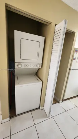 a kitchen with stainless steel appliances a refrigerator sink and cabinets