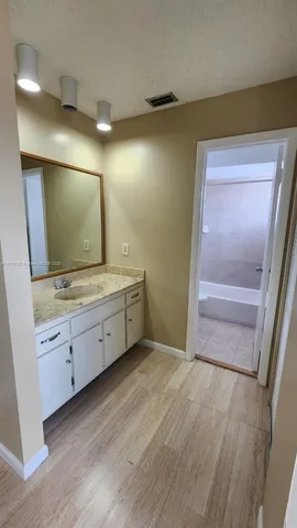 a bathroom with a toilet and a bathtub