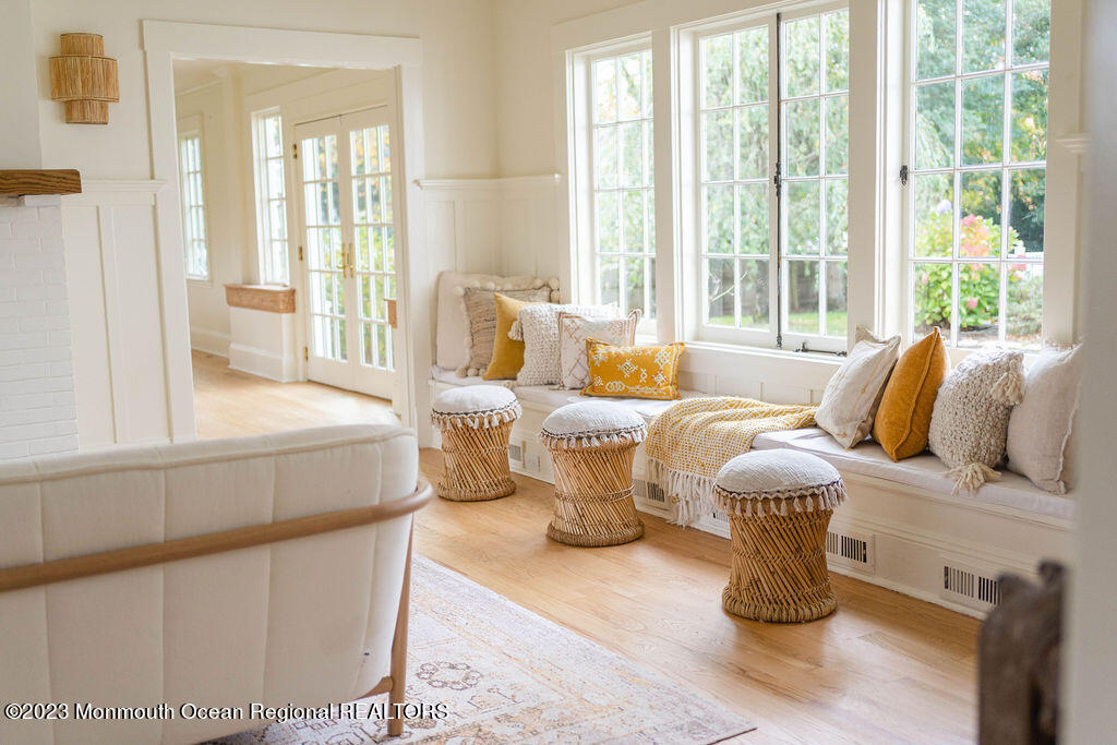 501 3rd Avenue Spring Lake, NJ 07762 - Photo 20 of 61 a living room with furniture and a floor to ceiling window