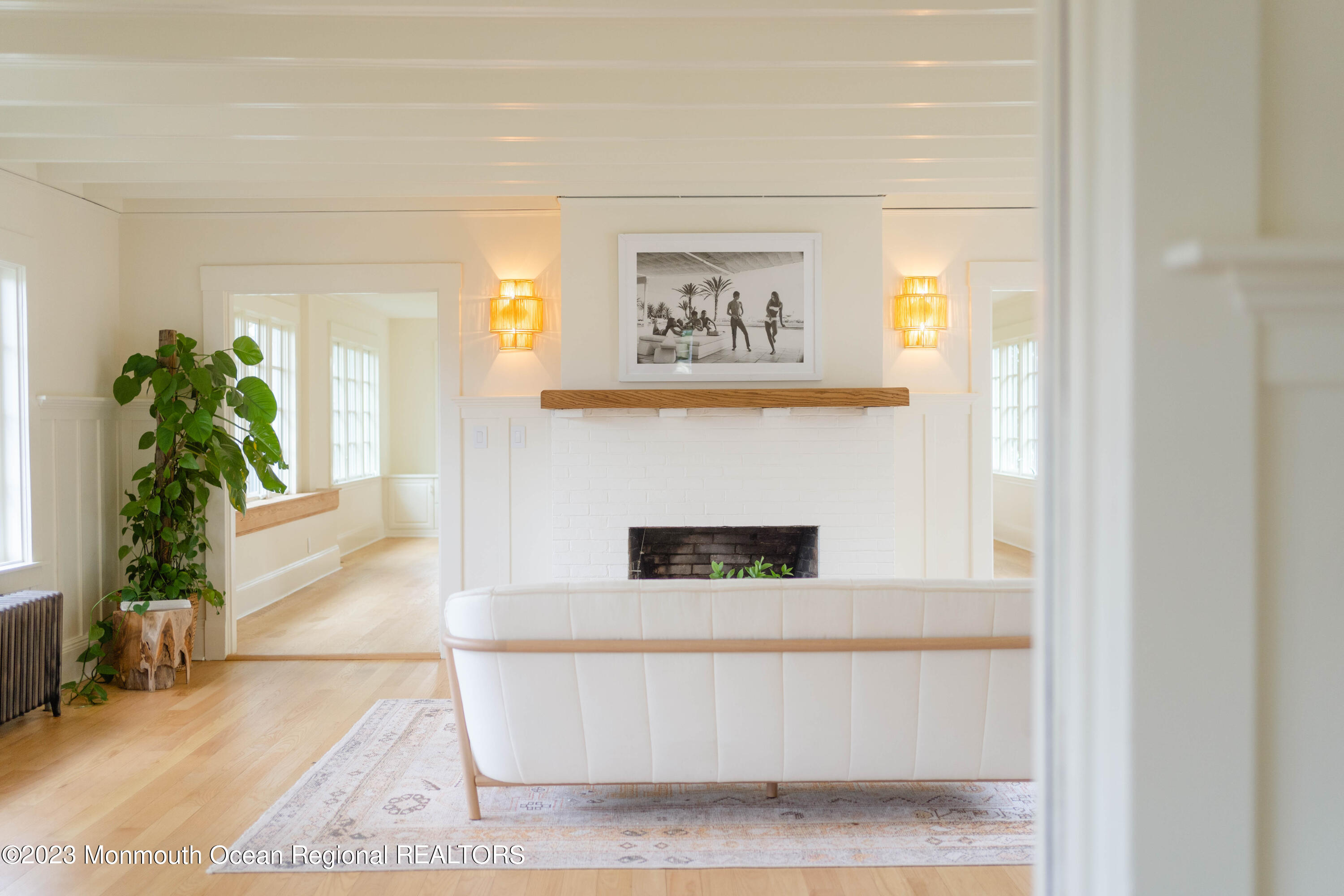 501 3rd Avenue Spring Lake, NJ 07762 - Photo 22 of 61 a living room with a rug and a potted plant
