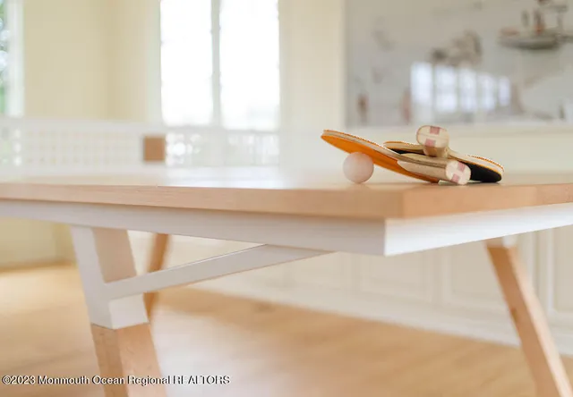 a large bed sitting in a bedroom next to a window