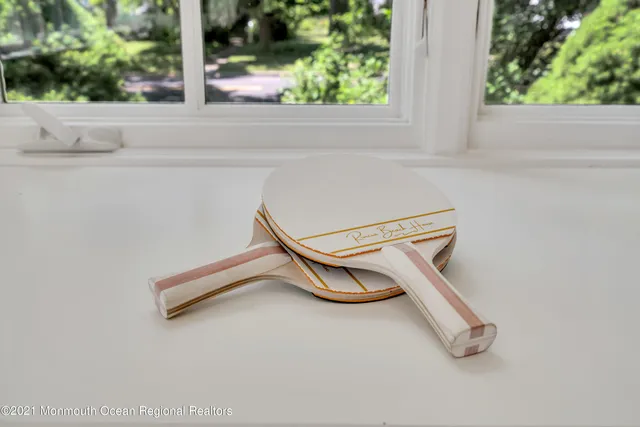 a bedroom with a bed and a night stand