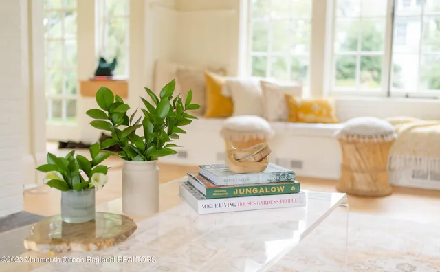 a bedroom with a bed and next to a window