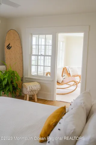 a bedroom with a bed and a dresser