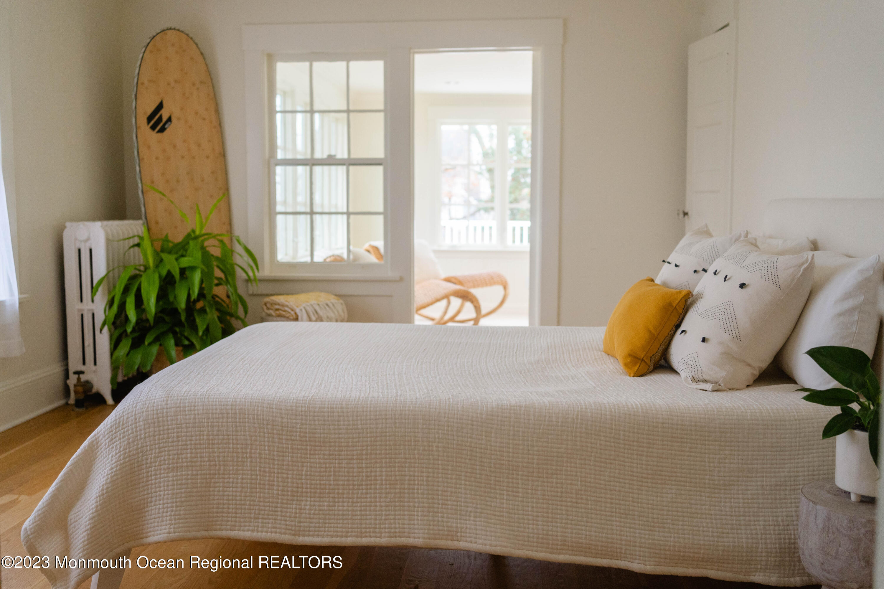 501 3rd Avenue Spring Lake, NJ 07762 - Photo 33 of 61 a large bed sitting in a bedroom next to a window