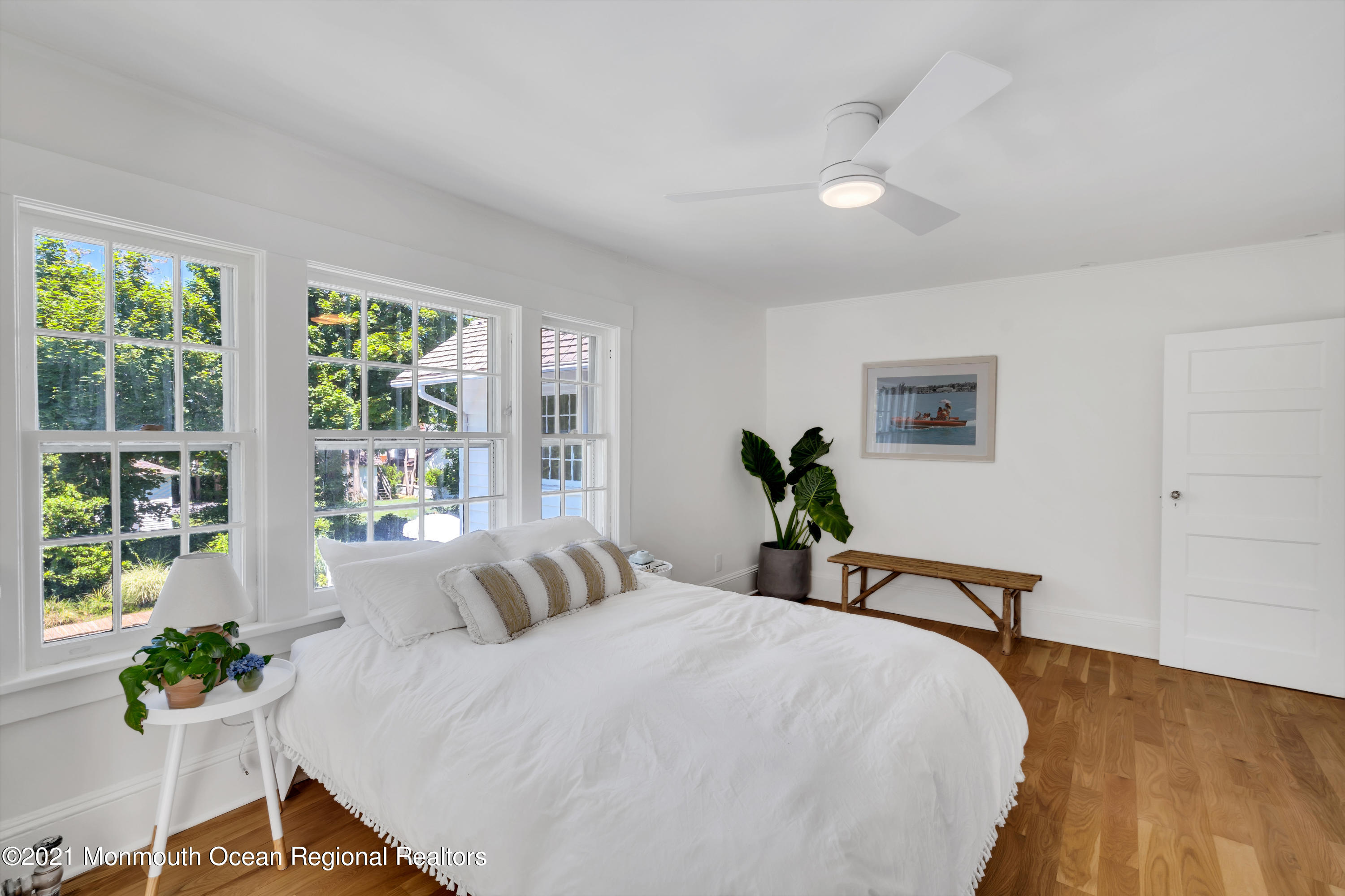501 3rd Avenue Spring Lake, NJ 07762 - Photo 38 of 61 a bedroom with a bed and a potted plant