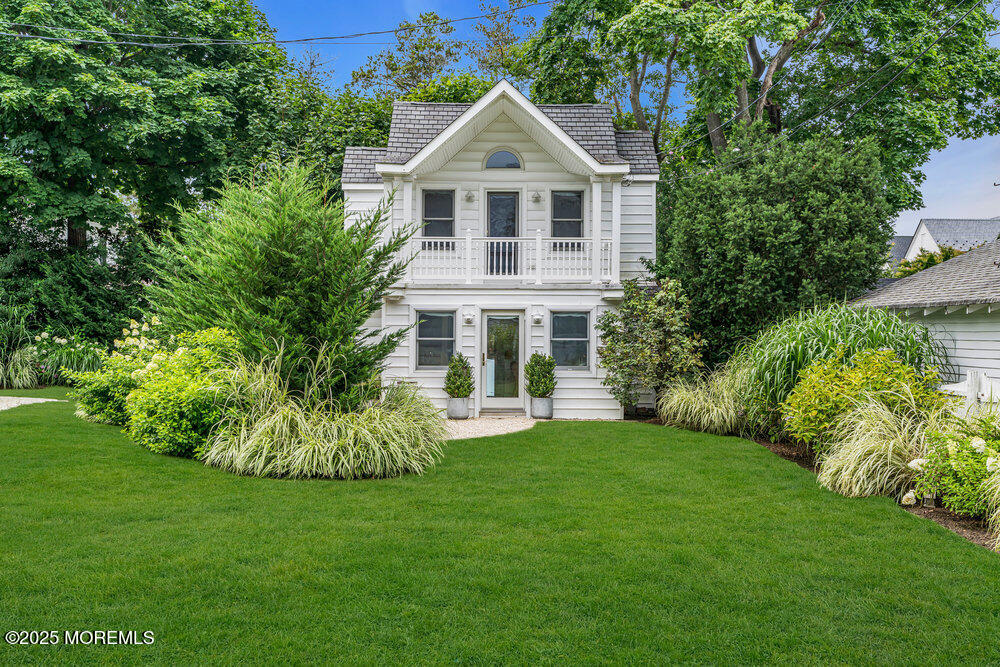501 3rd Avenue Spring Lake, NJ 07762 - Photo 42 of 61 a front view of a house with a yard and trees