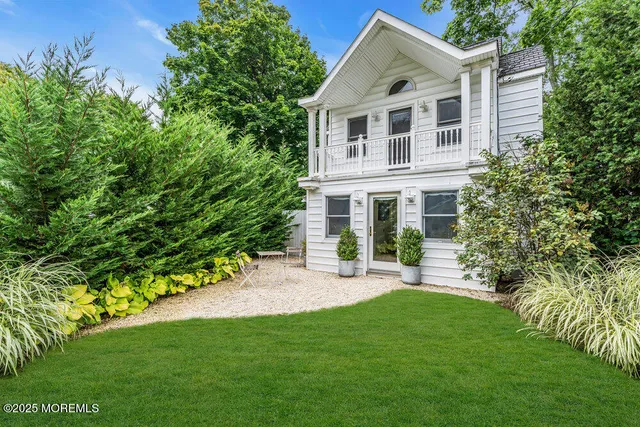 a bathroom with a tub sink and a mirror