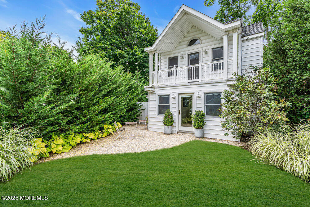501 3rd Avenue Spring Lake, NJ 07762 - Photo 43 of 61 a front view of a house with a yard and trees